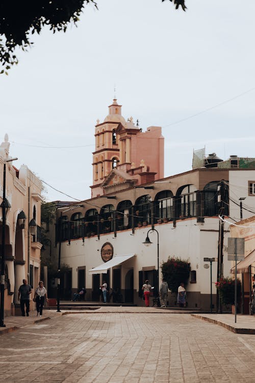 Empty Street among Buildings in Town