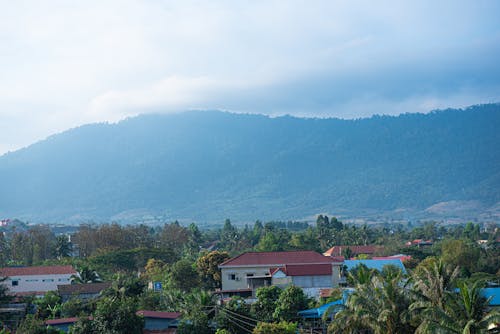 Landscape with Buildings and Mountains in Fog