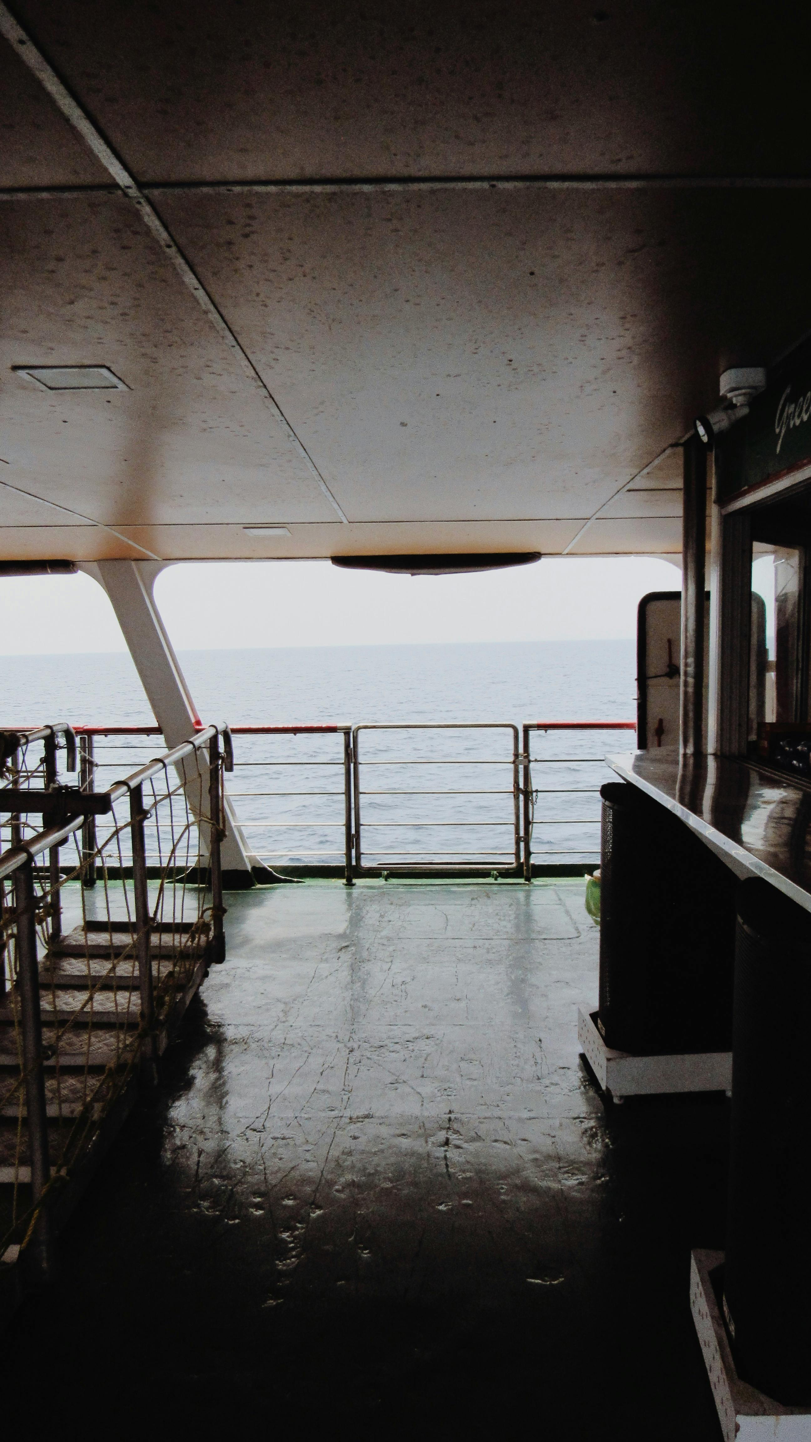 a view of the ocean from the deck of a ship