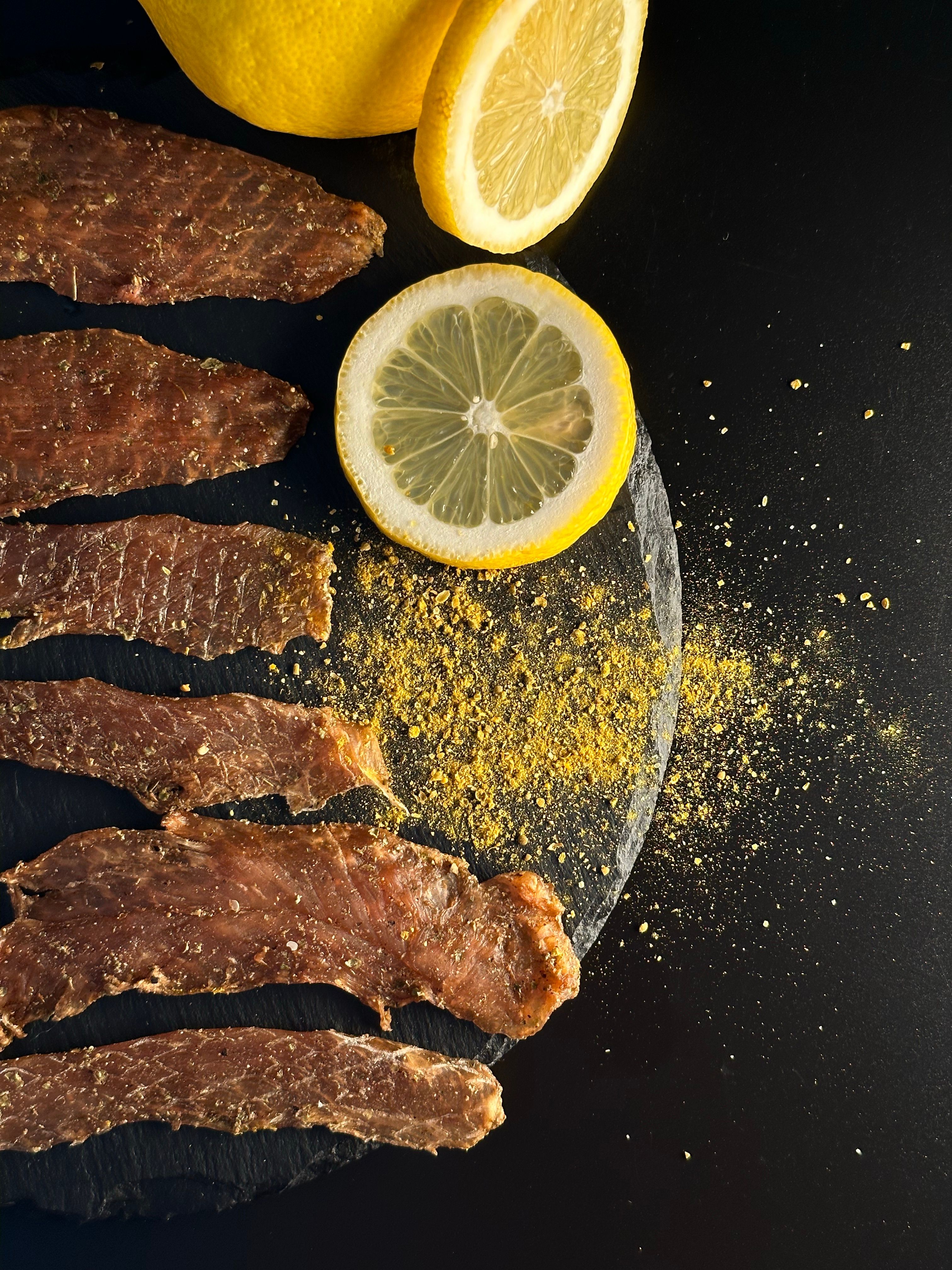 Strips of Meat Sprinkled with Turmeric Powder and Served with Lemon ...