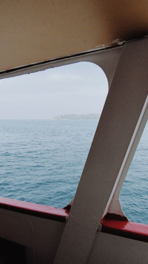 Free Serene ocean view from a ship's window near Port Blair, India. Stock Photo