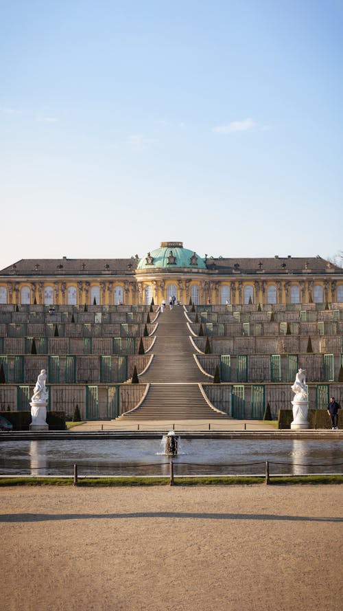 A large building with a fountain in front of it