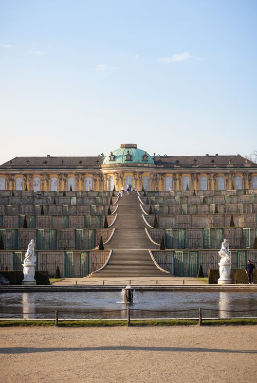 Free A frontal view of the iconic Sanssouci Palace in Potsdam with its grand staircase and gardens. Stock Photo