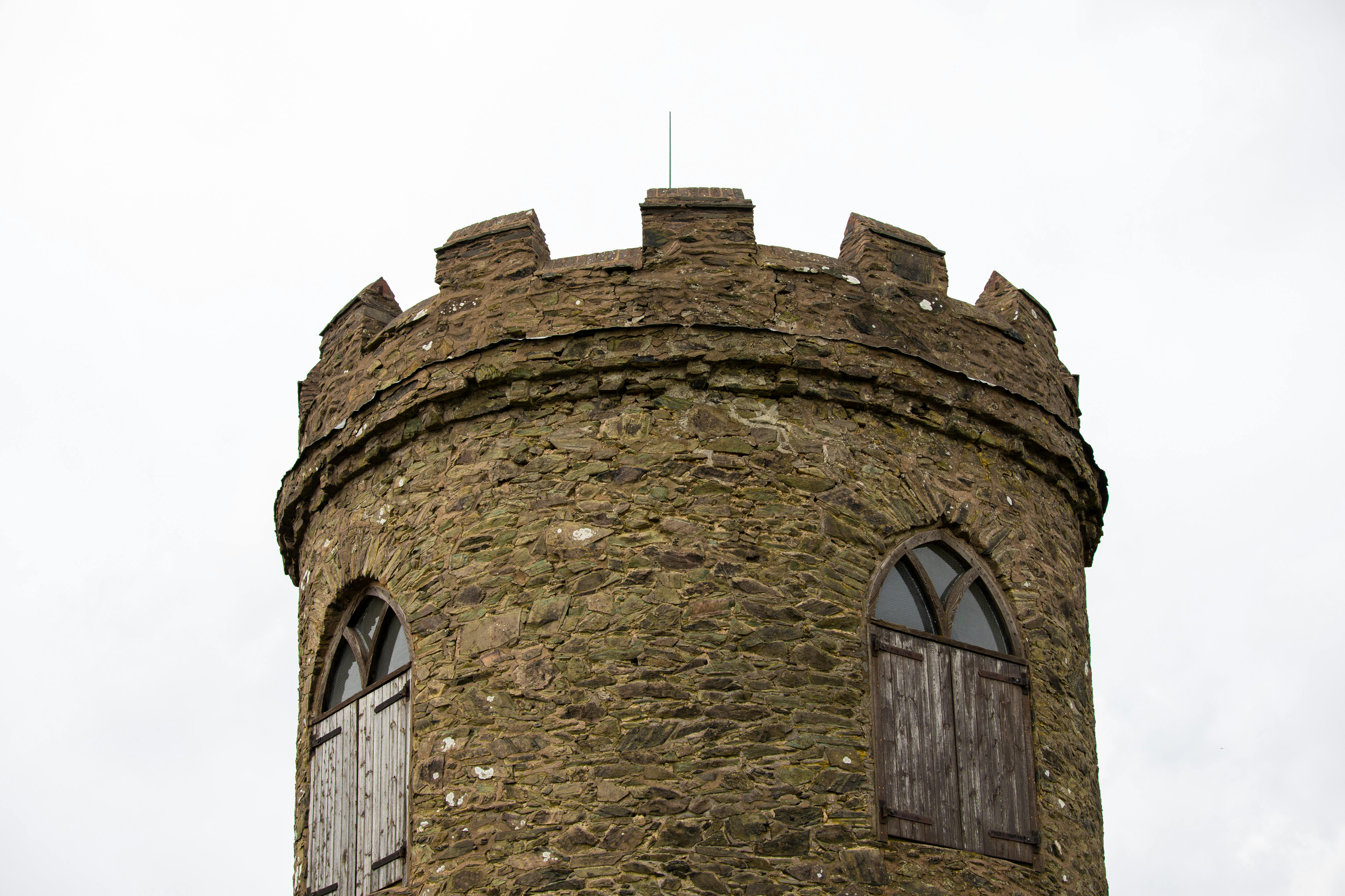 A rustic medieval stone tower featuring arched windows in Leicester, UK.