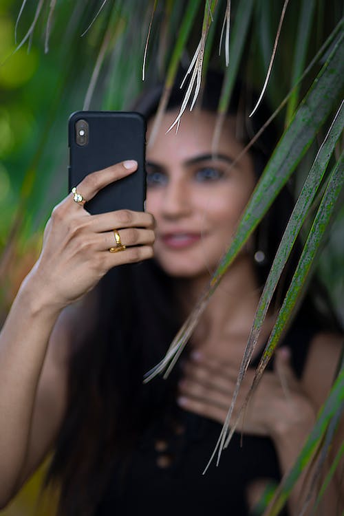 Free Selective Focus Photo of Woman Holding Phone Stock Photo