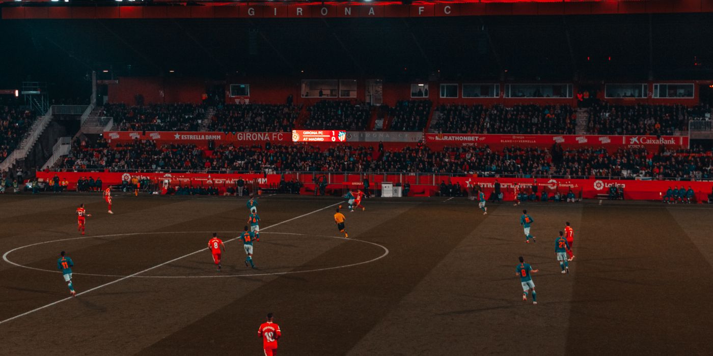 A packed soccer stadium crowd during a match