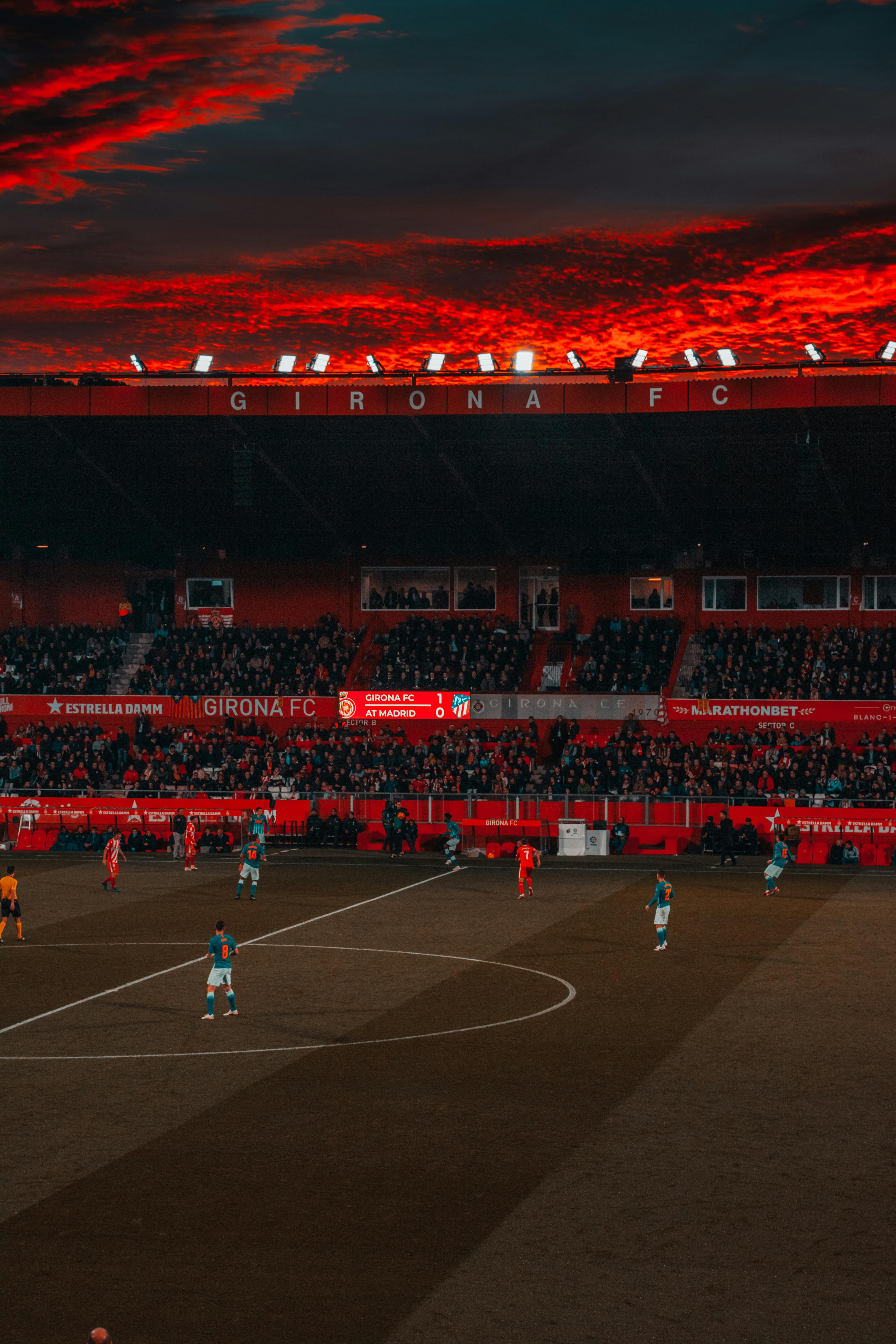 Premium Photo  Soccer stadium on red steam background