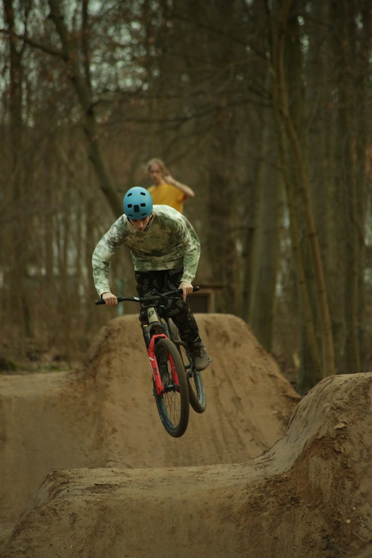 Teenager Boy Jumping On BMX Bike