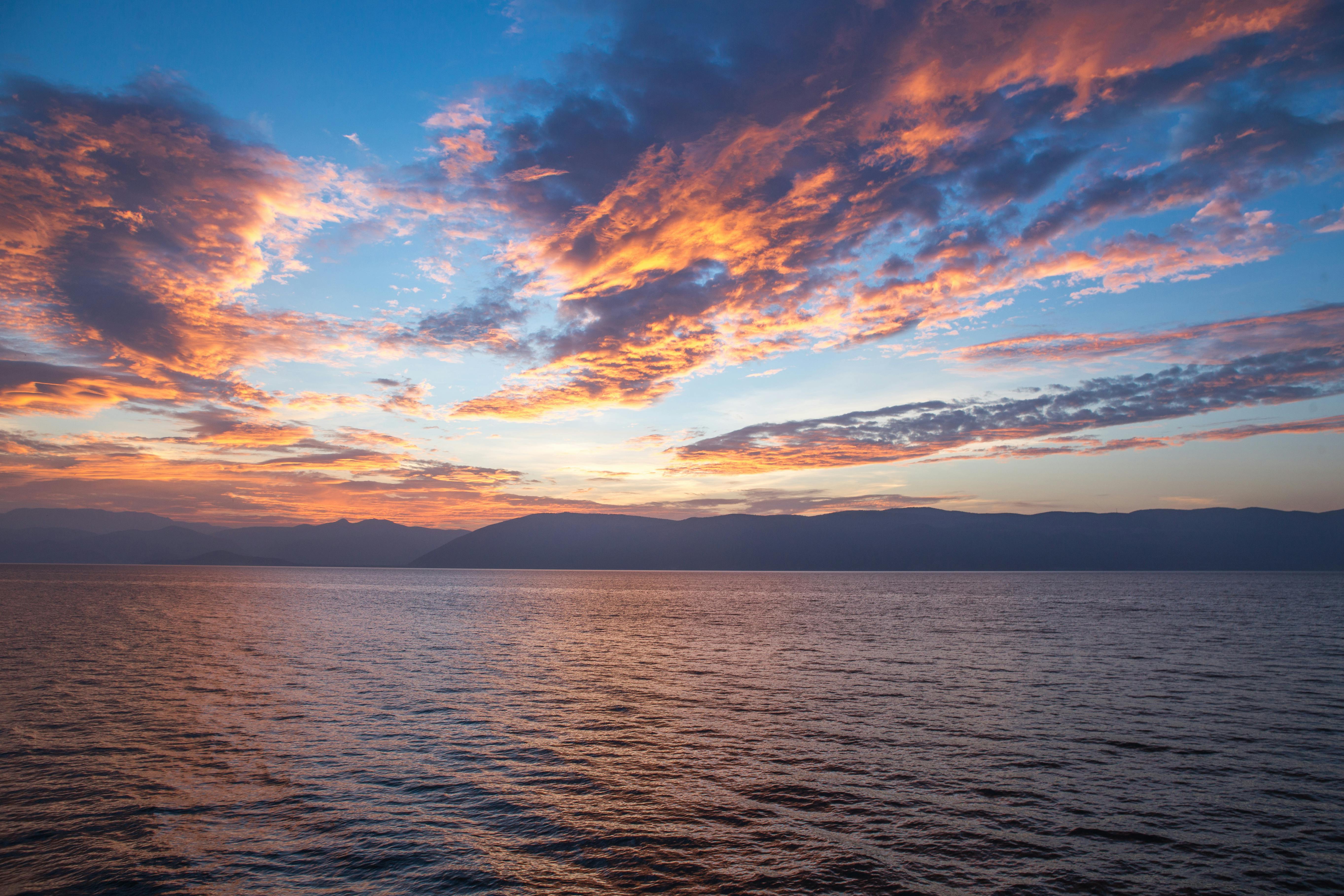 Body Of Water Under Cloudy Sky During Daytime Free Stock Photo