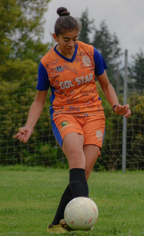 Young Woman Playing Soccer 