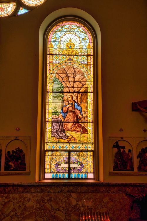 Free Intricate stained glass window depicting biblical scenes inside a church in Winona, MN. Stock Photo