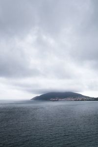 Cover art for a novel: misty coastal headland. Photo by Javier Balseiro on Pexels