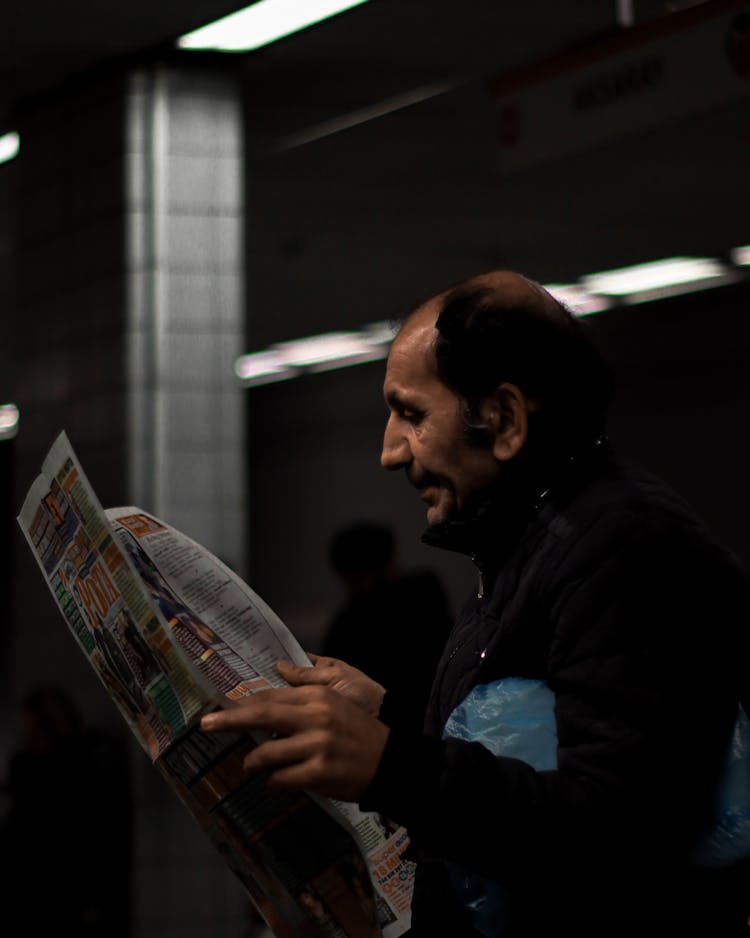 Man Reading Newspaper