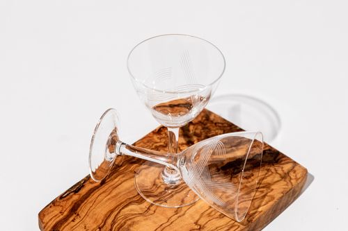 Free Two empty crystal glasses on a wooden board with a minimalist design, perfect for decor ideas. Stock Photo
