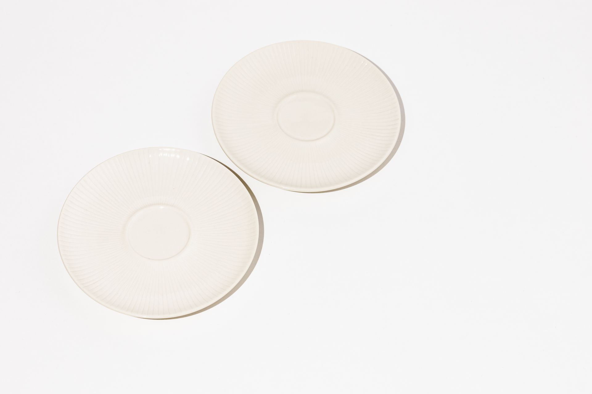 Porcelain small white plates with interesting detail