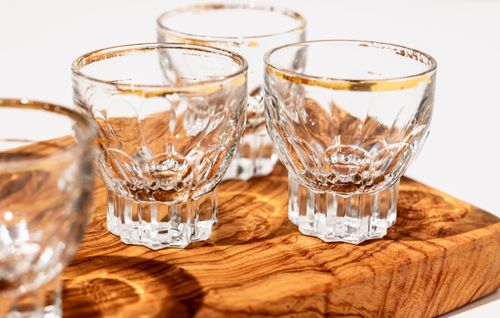 Free Close-up of beautiful empty crystal glasses on a wooden tray, perfect for drinks. Stock Photo