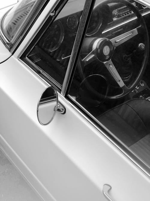 Steering Wheel and Window of Vintage Car