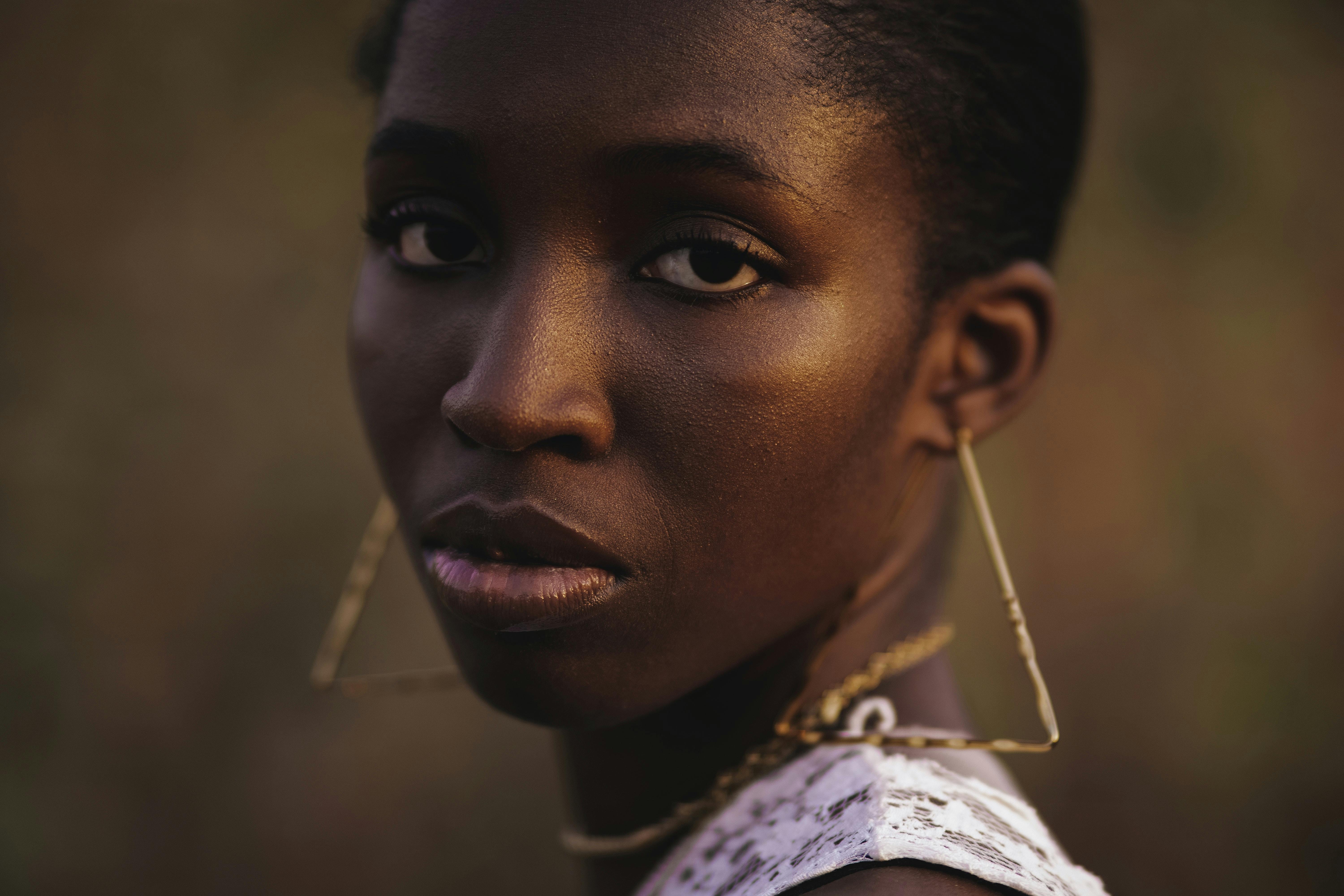 face of woman with earrings