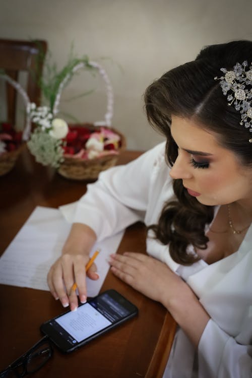 Bride Checking Her Smart Phone 