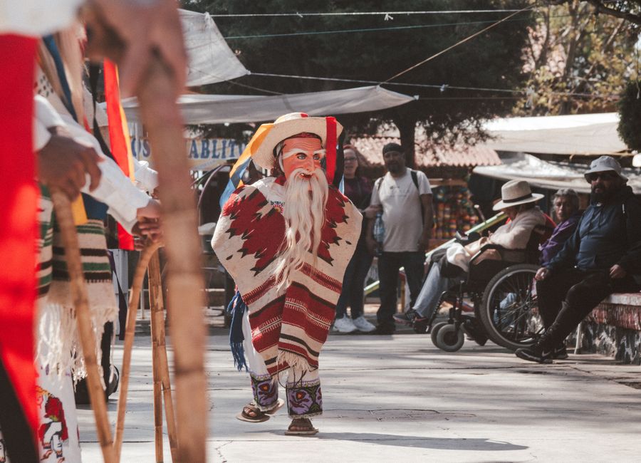 Cultural dancers perform in traditional attire in Janitzio, Michoacán, Mexico.