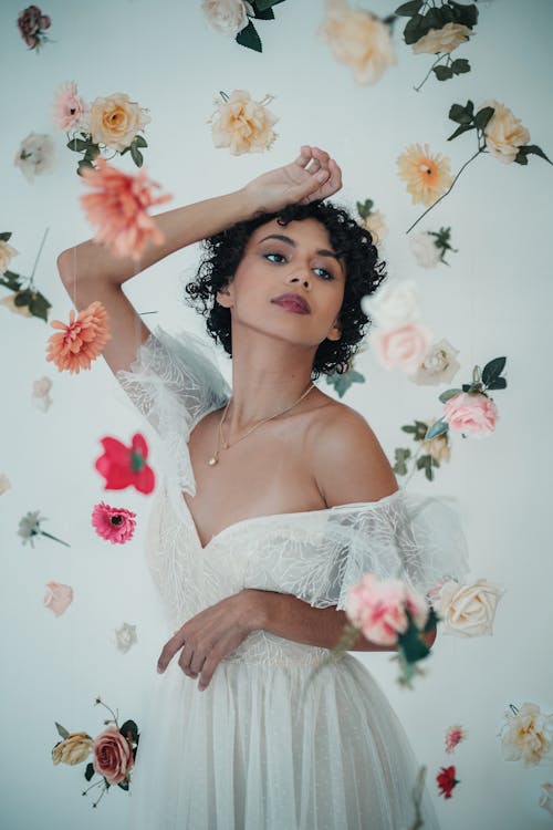 Studio Shoot of a Woman Among Falling Flowers