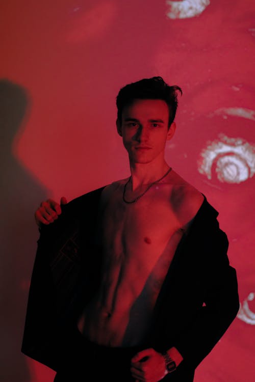 A Bare Chested Man in Red Light