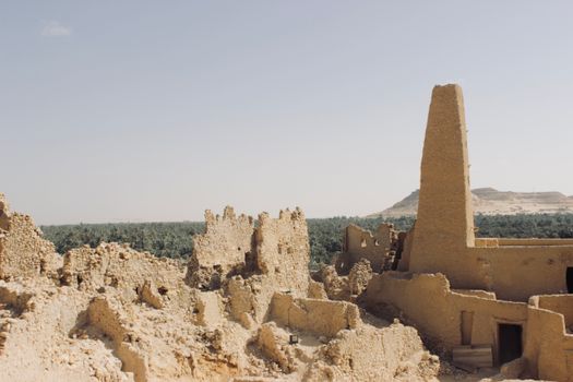 Explore the ancient ruins of an oracle temple amidst Egypt's arid landscape in Matrouh Governorate.