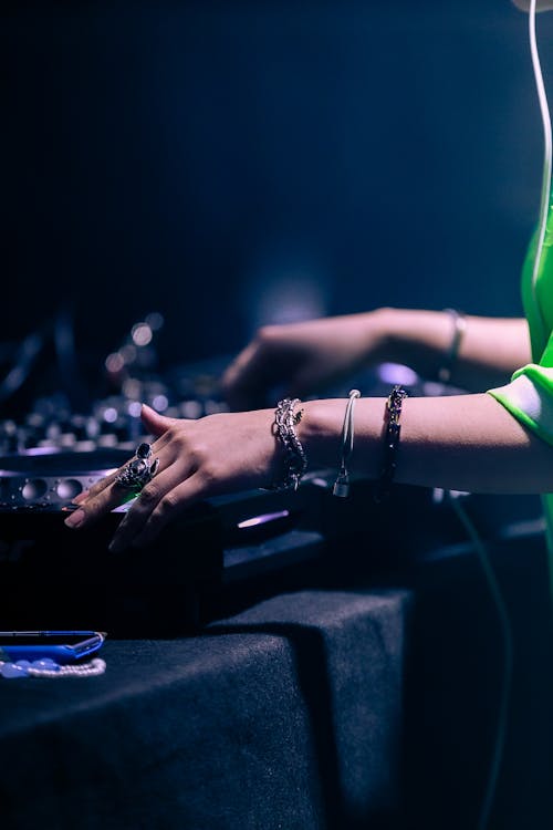 Close-up of a DJ Mixing Music on a DJ Controller