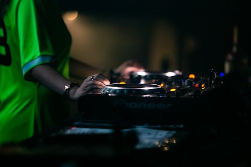 Close-up of a DJ Mixing Music on a DJ Controller