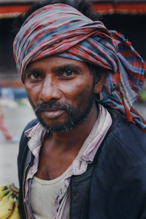 Free Close-up portrait of a middle-aged man wearing a traditional headscarf, showcasing cultural attire. Stock Photo