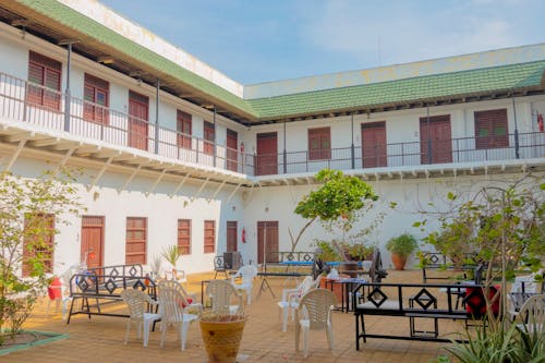 Patio Benches and Chairs Outside 2-storey Building