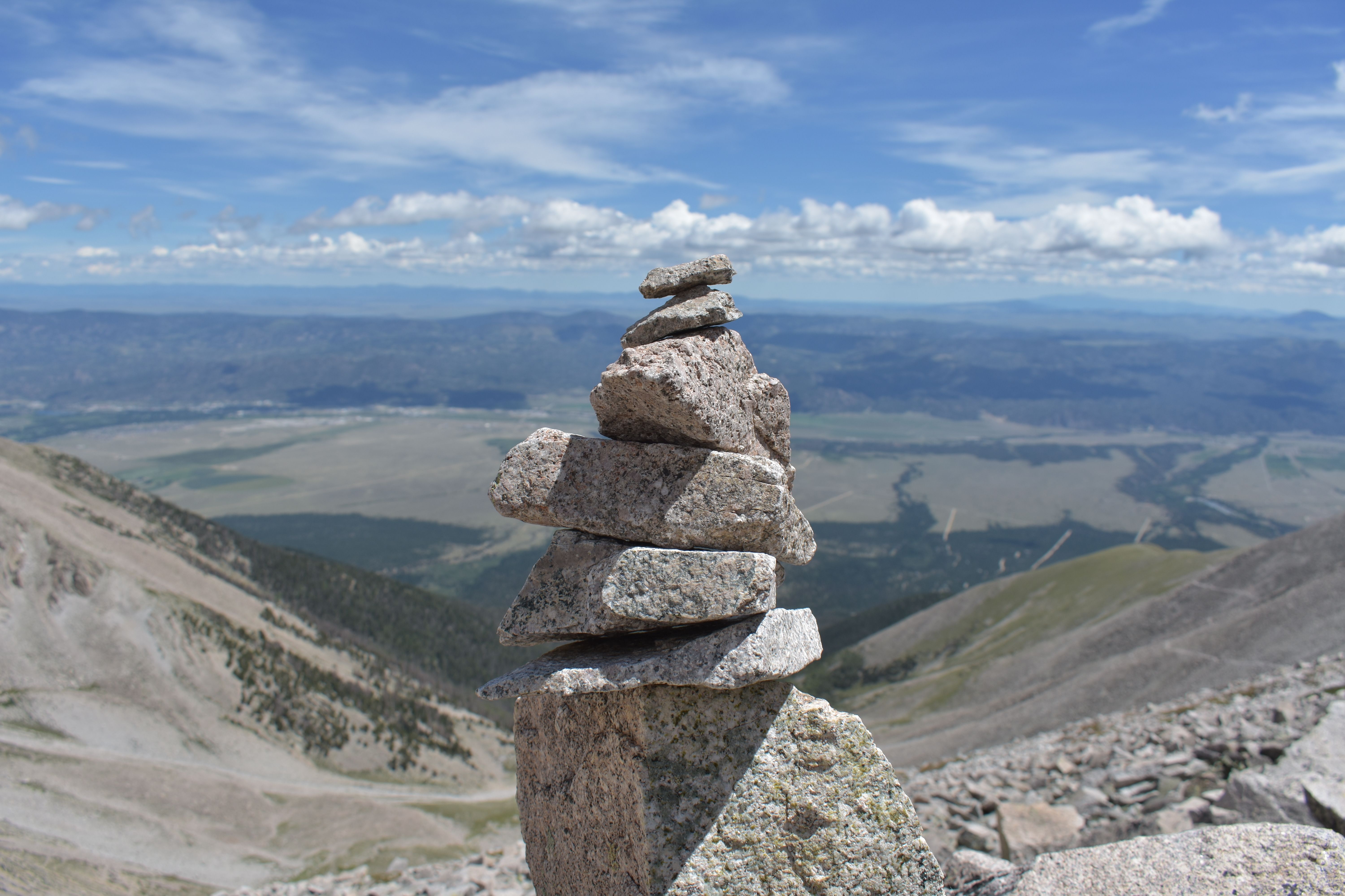 A trail cairn marking the route above treeline