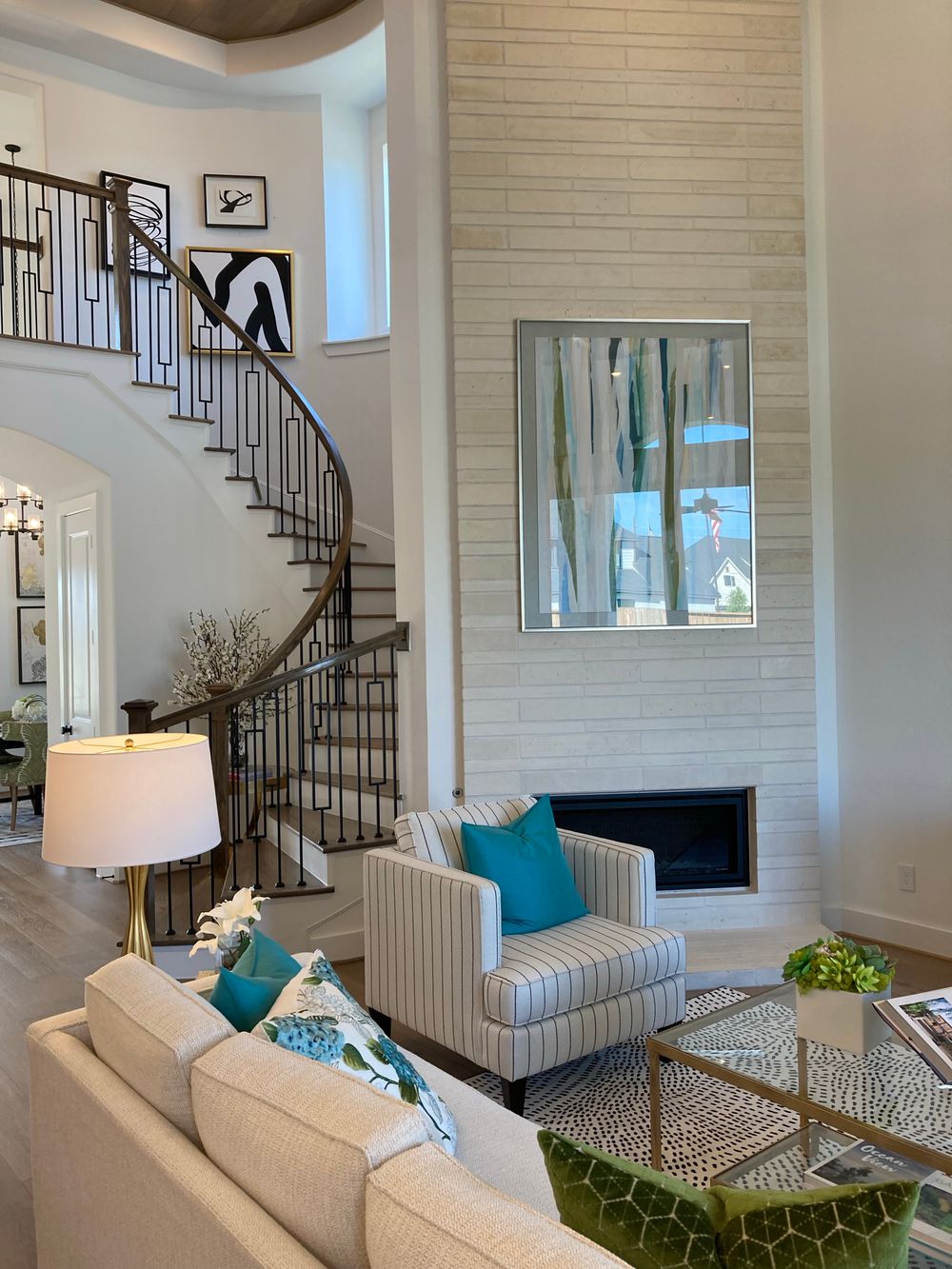 Linear fireplace anchoring a double-height great room