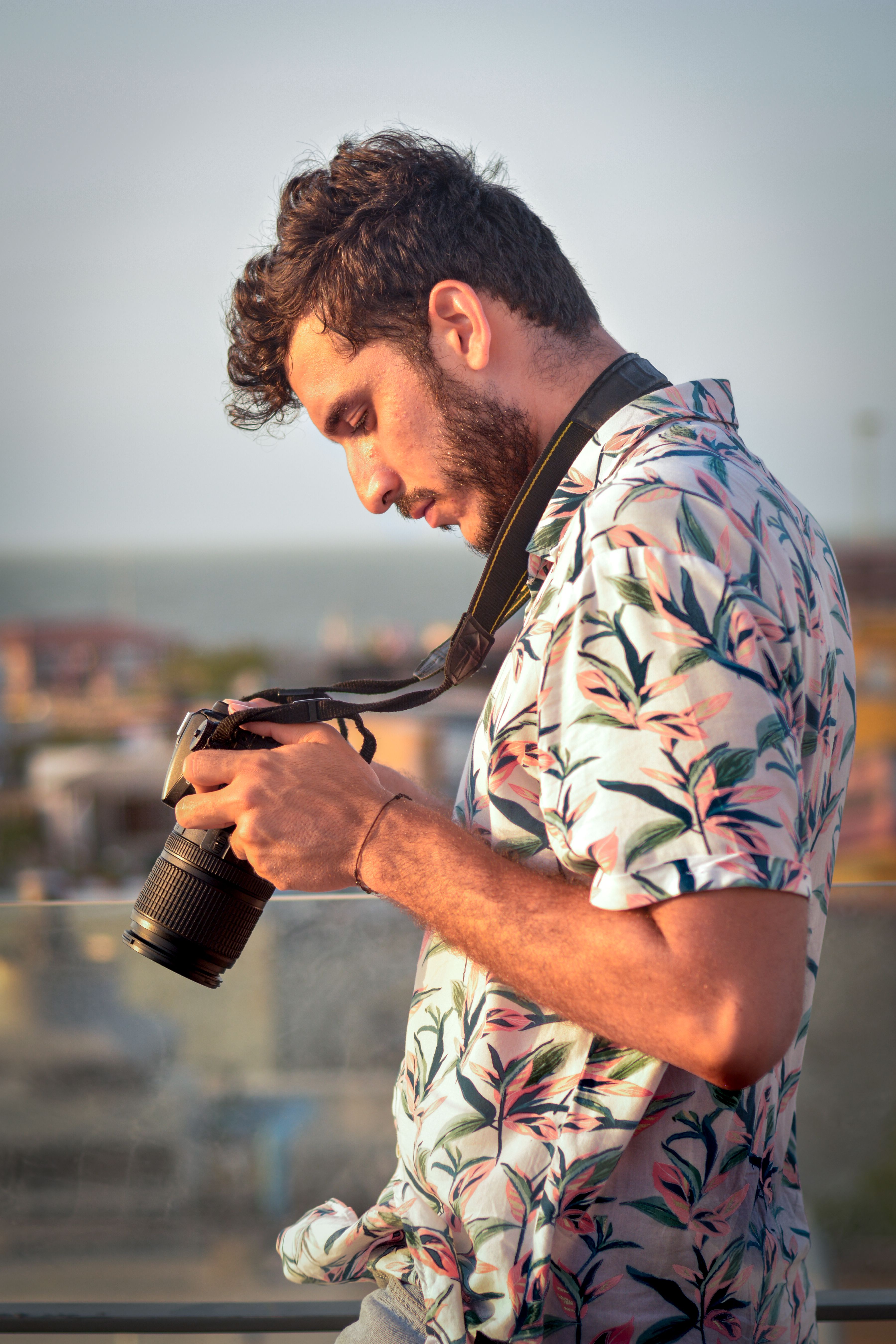 Young male photographer exploring the vibrant streets of Cartagena, Colombia.