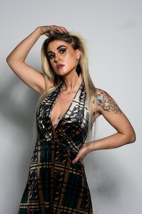 A Portrait of a Blonde Woman with Tattoo