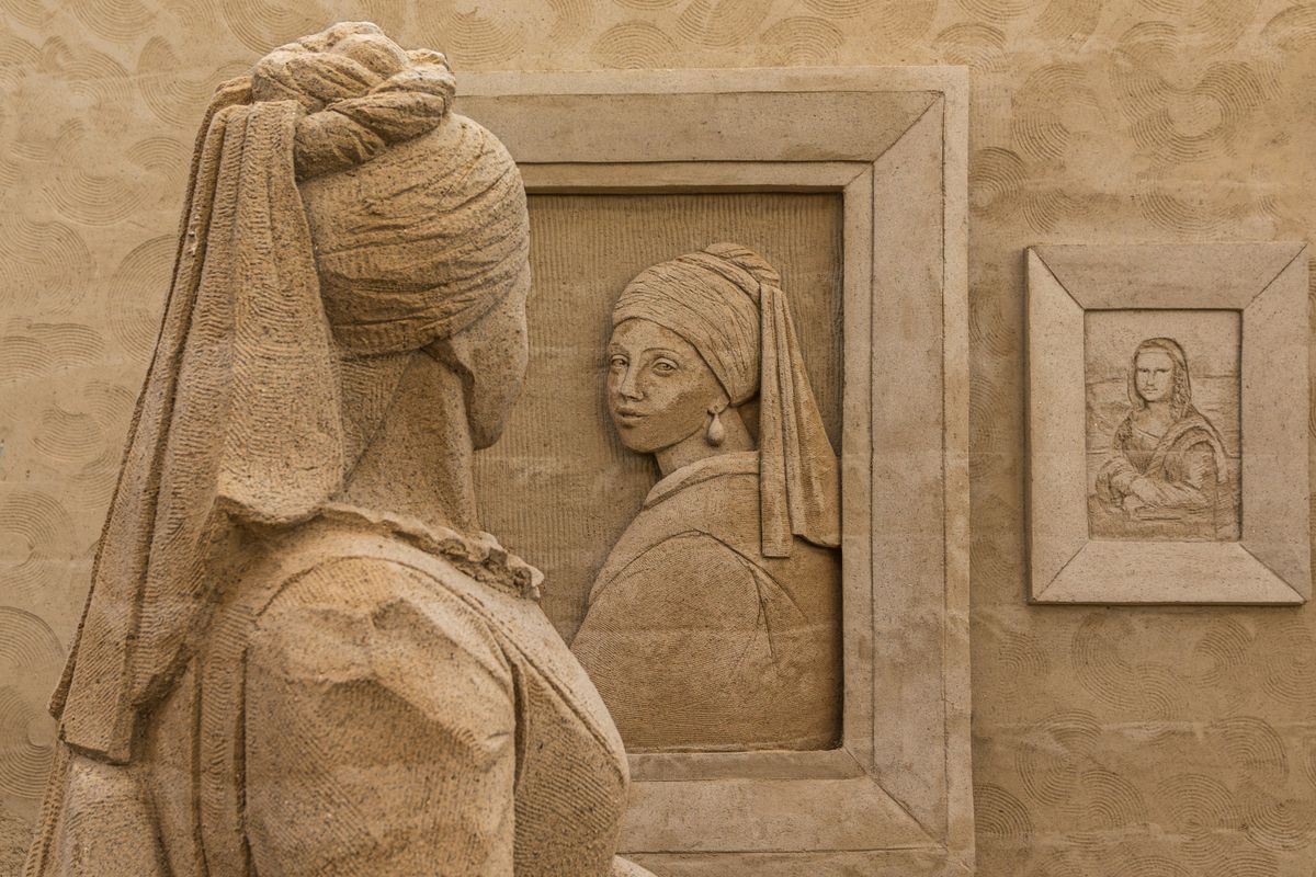 Intricate sand sculpture artwork on display at an open-air sand sculpture museum