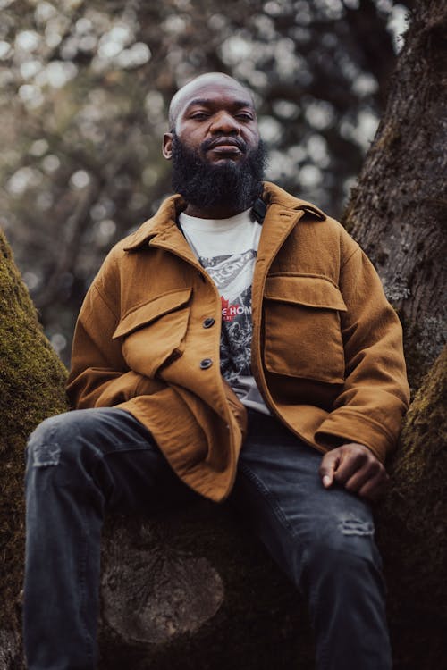 African Man Sitting on a Tree 