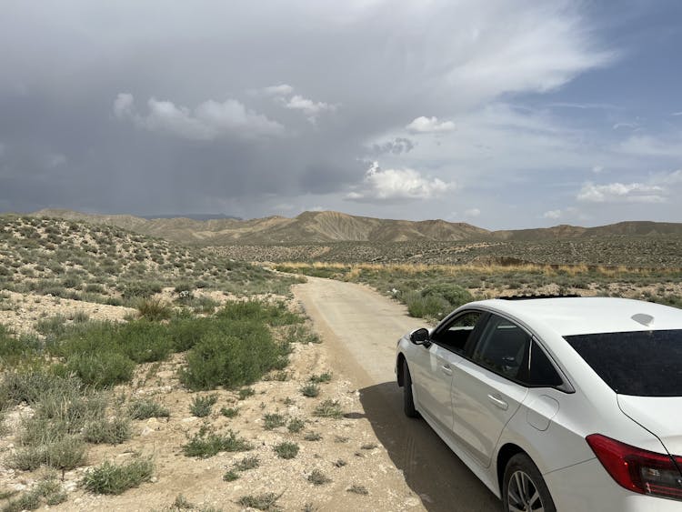 White Honda Civic On Dirt Road