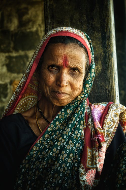 Portrait of an Elderly Woman Wearing a Headscarf 