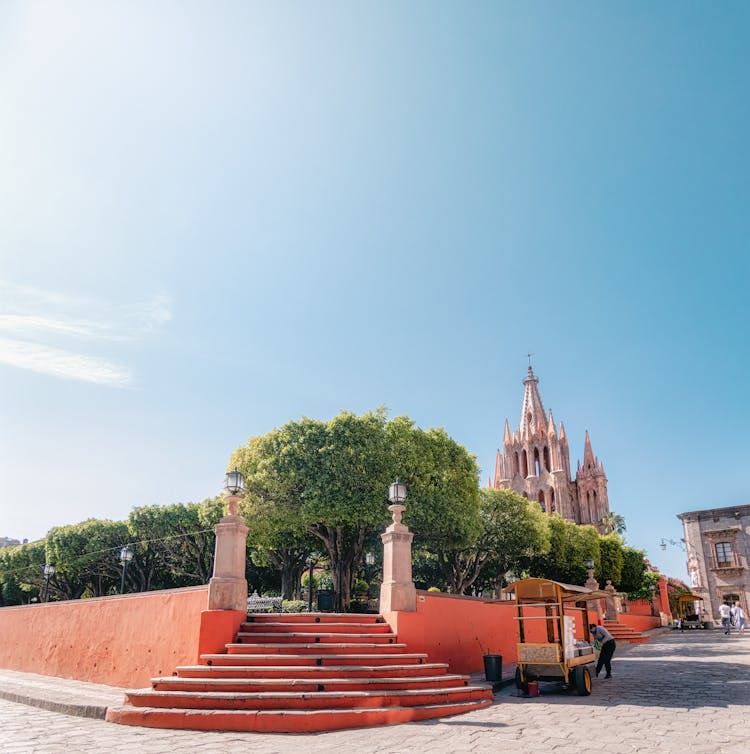 Park With Trees And San Miguel Arcangel Parish Church Behind