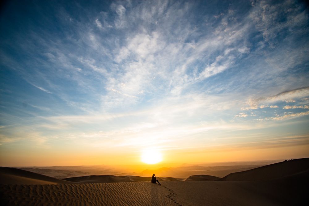 Warm golden sand dunes at sunset