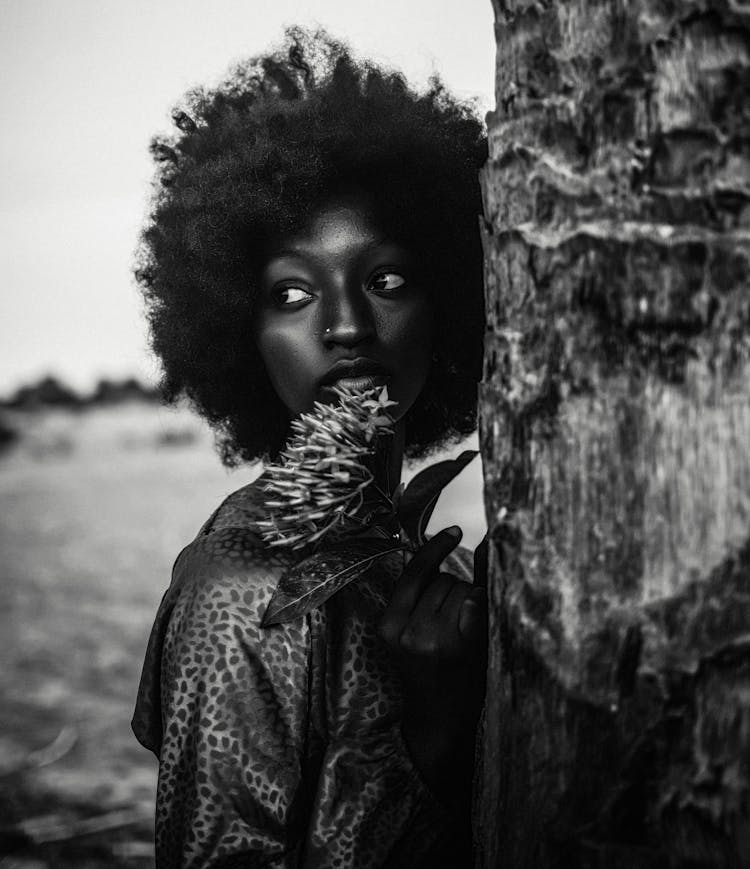 Black And White Portrait Of A Young Woman With A Flower 