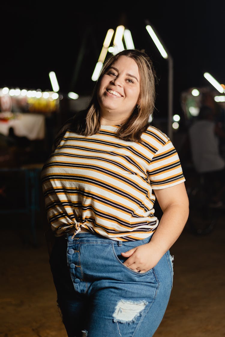 Portrait Of Smiling Woman At Night