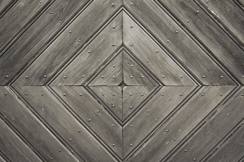 Black and White Photography of Wooden Surface 