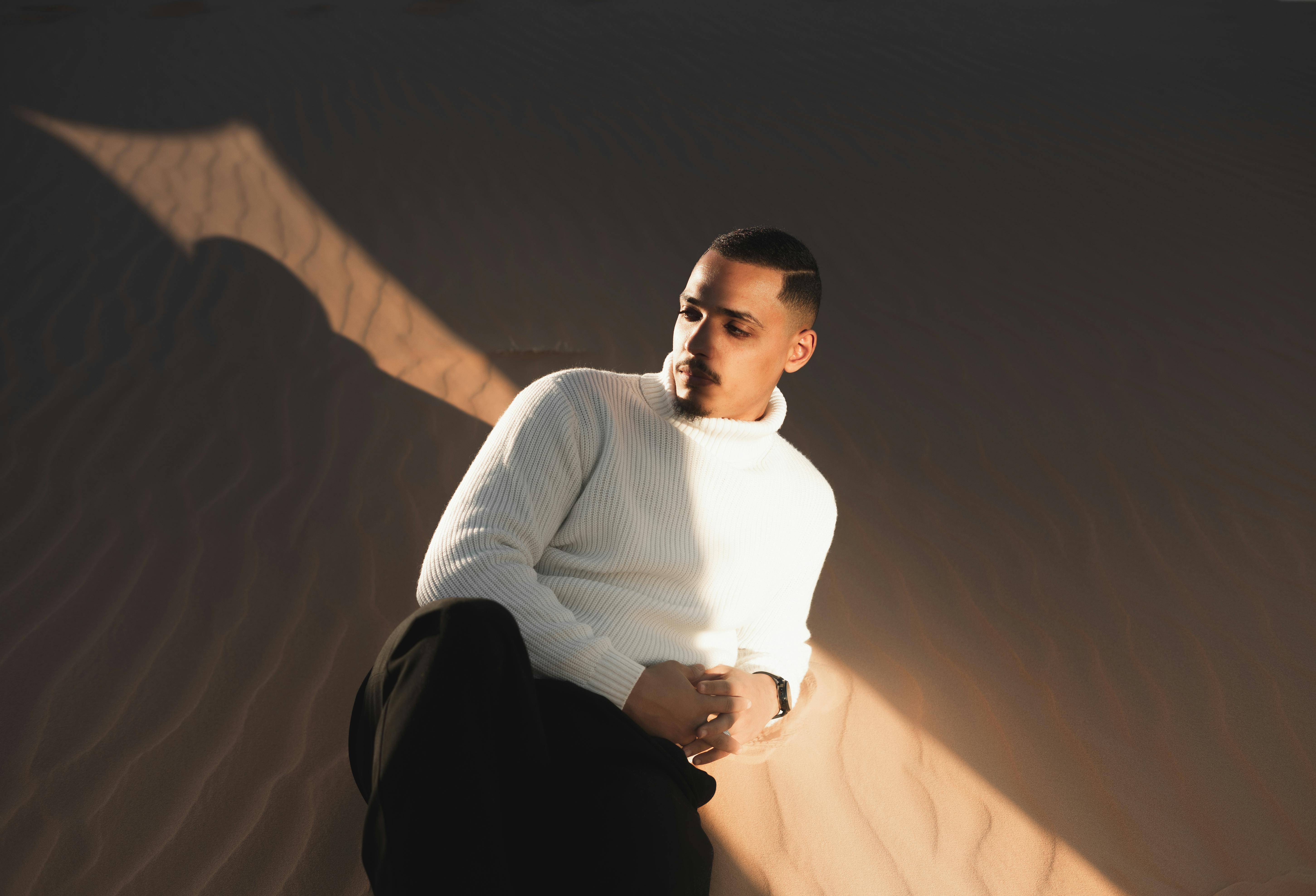 Young Man Lying on the Desert Sand