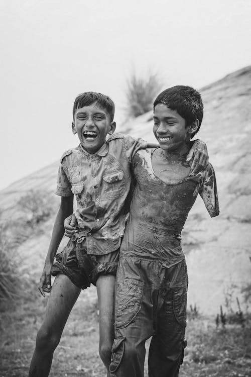 Kids in Mud Smiling and Laughing