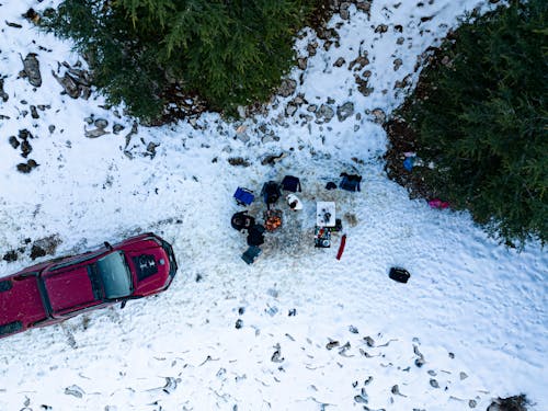 Birds Eye View of People Camping around a Fire in Winter 