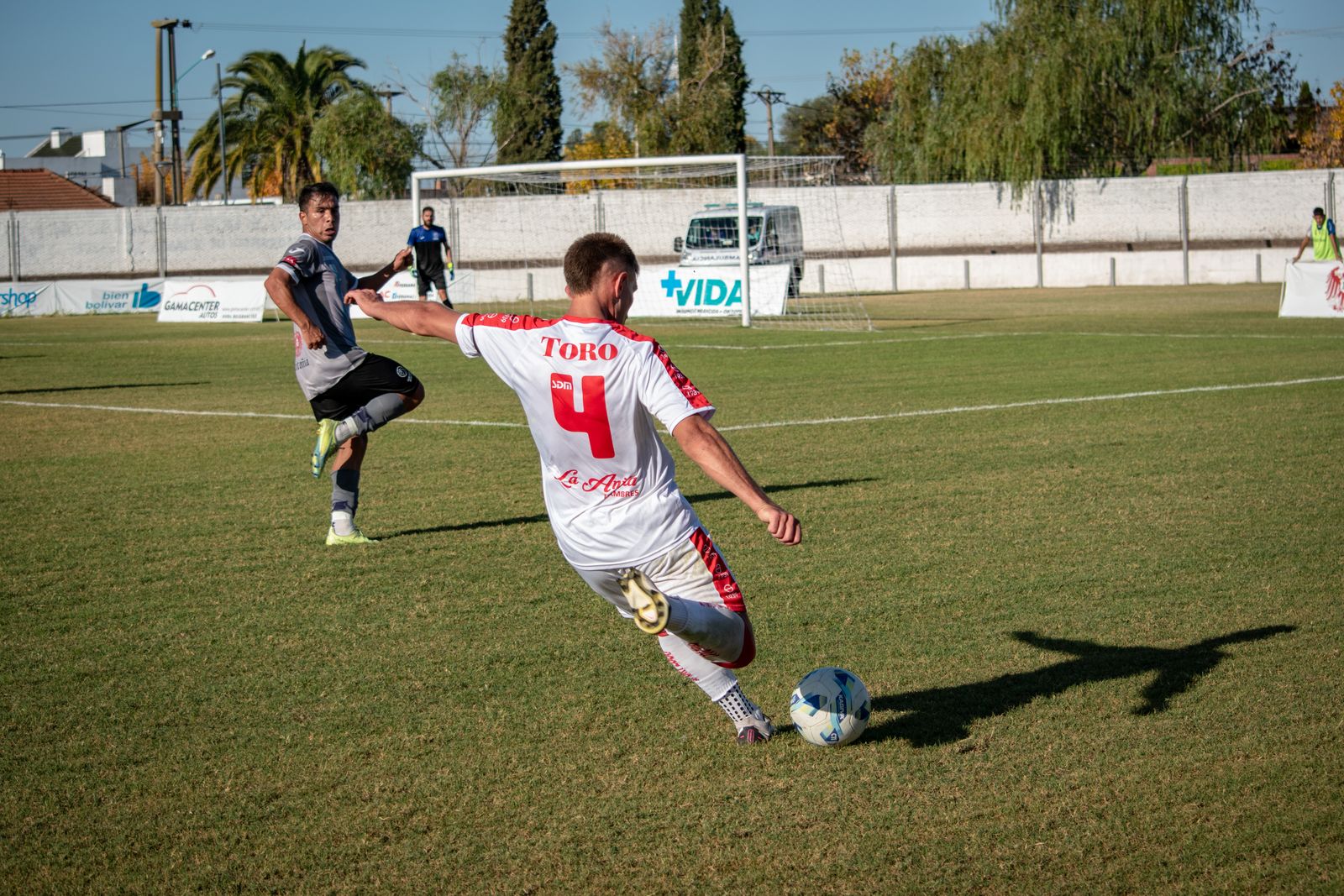 Illustrative soccer action photo for this sample profile