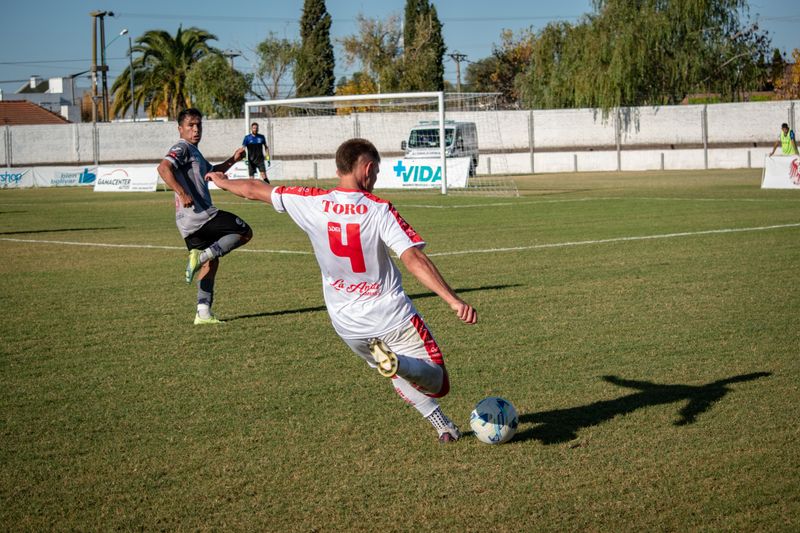 Soccer players in action on a field