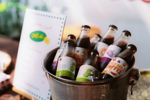 Cold brew coffee bottles chilled in an ice bucket, perfect for a refreshing drink.